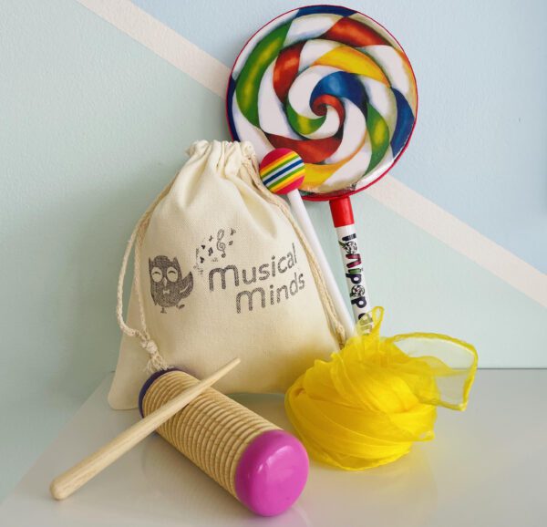 Instrument pack with lollipop drum, guiro, scarf and bag